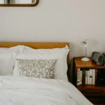 Ivory duvet cover set on a wooden bed shown to scale in a cosy bedroom